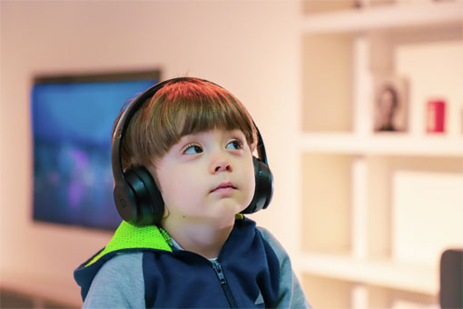 Small boy with headphones on