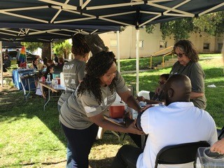 VA medical staff giving health checks at outdoor event