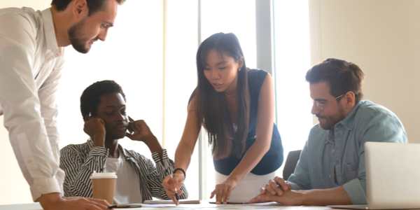 Diverse group of coworkers collaborating over a conference table