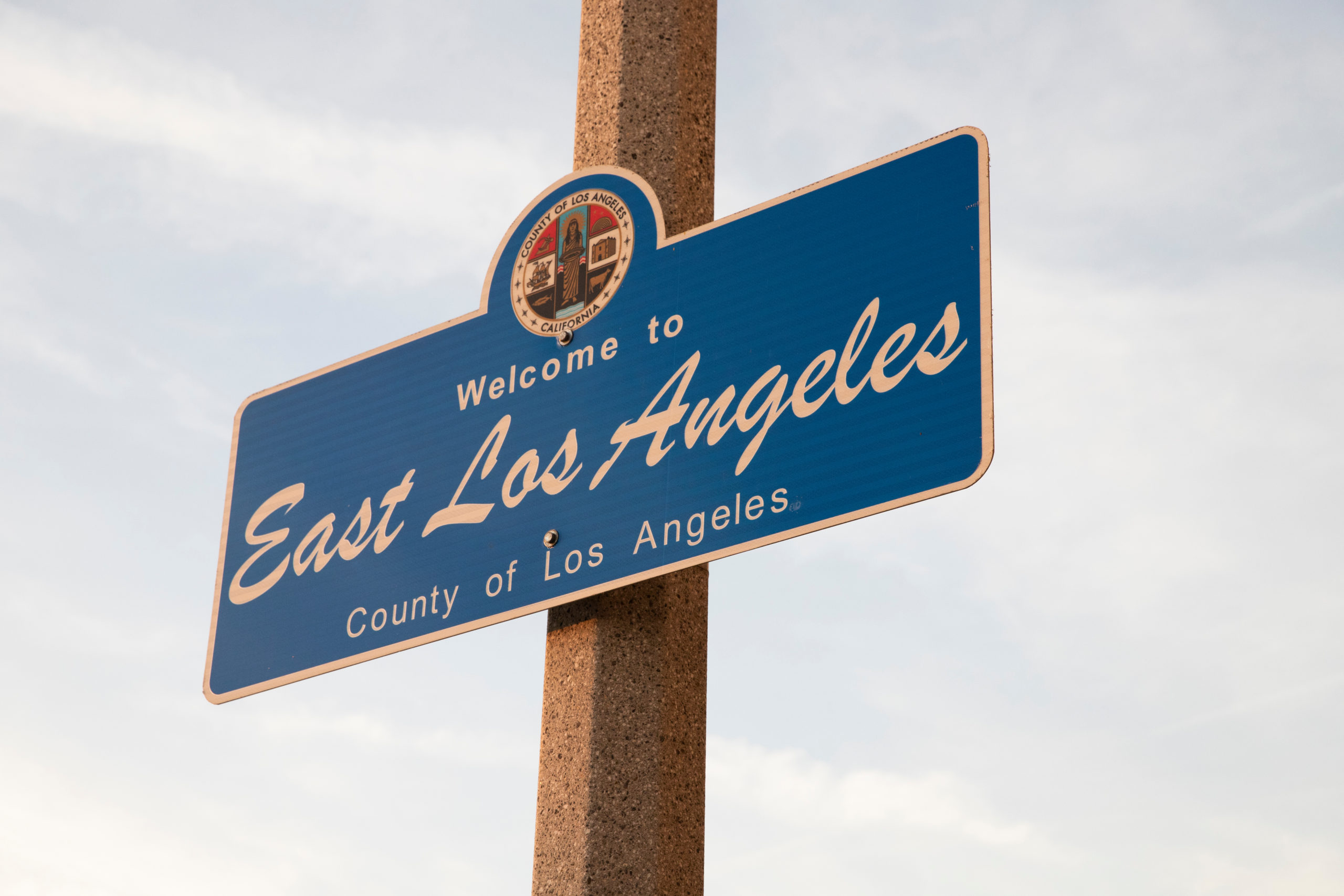 Street sign reading: 'Welcome to East Los Angeles'