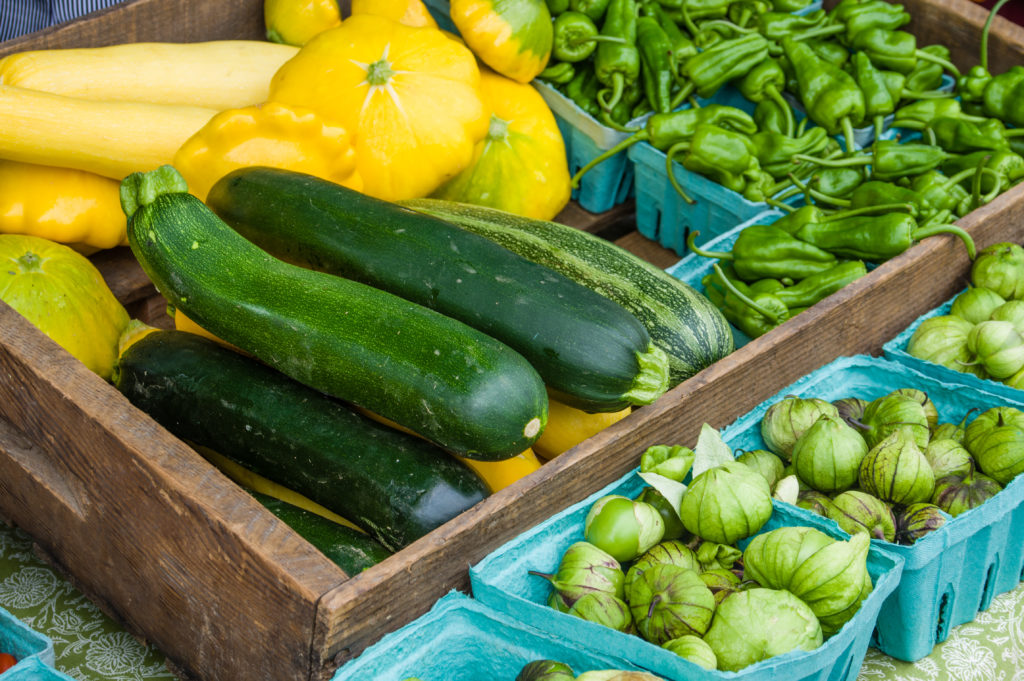 squash, tomatillos, and chiles at farmer's market