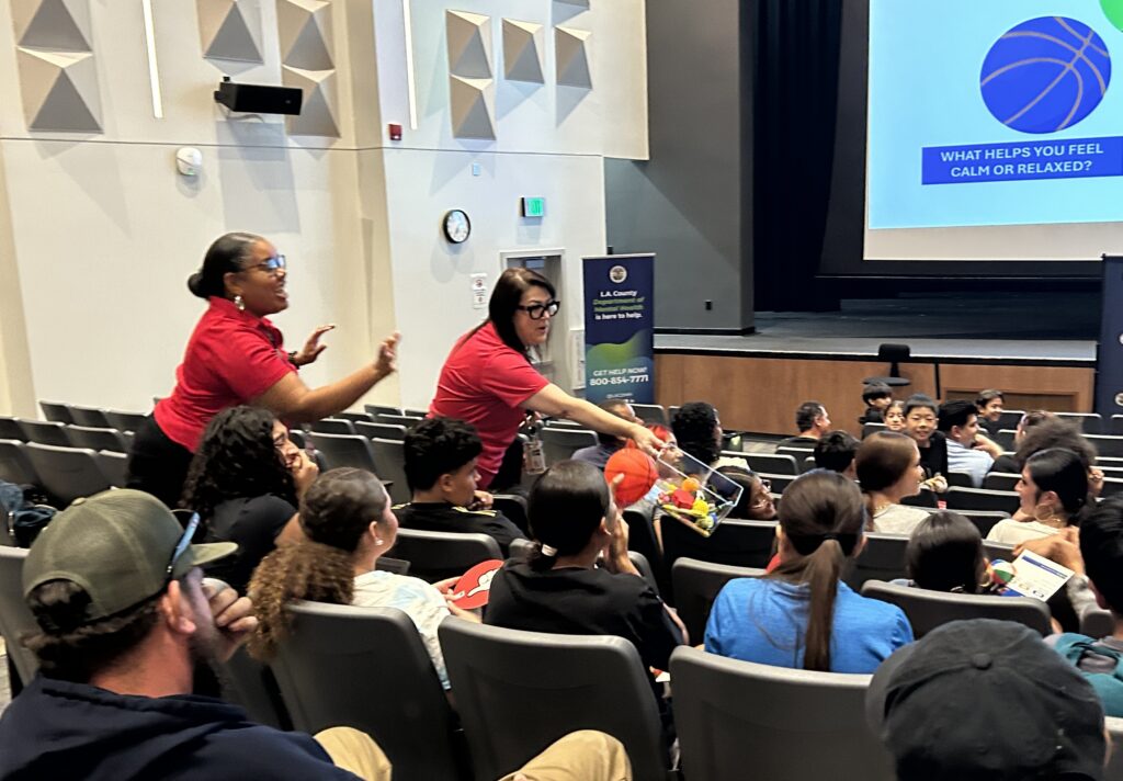 LACDMH Clinicians Melanie Lee and Yolanda Renteria interacting with youth at a mental health workshop